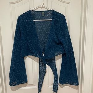 Teal crop top with bell sleeves that ties in front